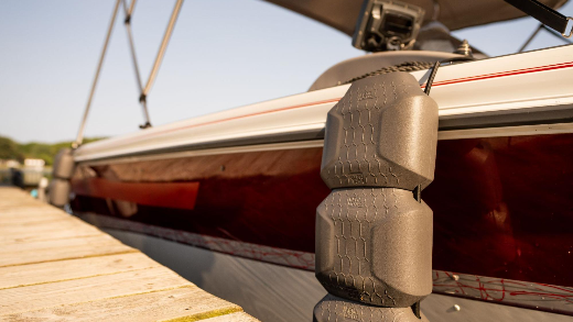 Using a Kemimoto boat fender to protect the boat from the dock