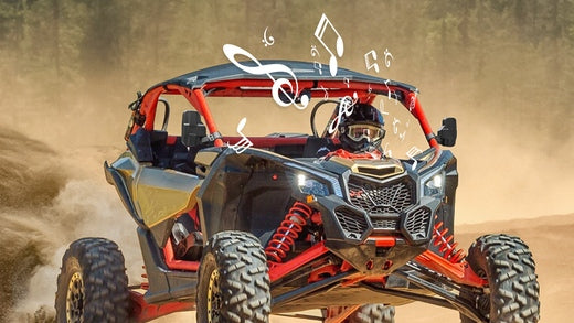 A man enjoying music in his UTV during an off-roading adventure