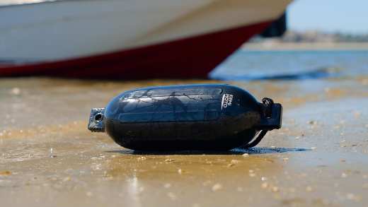 A Kemimoto inflatable boat dock bumper on the beach