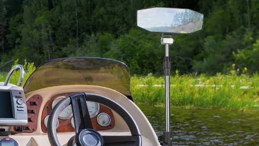 A boat equipped with Kemimoto’s 360° Adjustable Boat Rear Mirror with Telescoping Pole, 4.5x8