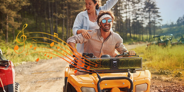 a man is riding an ATV installed sound bar