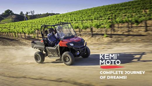 Men driving a Honda Pioneer 700 with a Kemimoto windshield installed on the farm