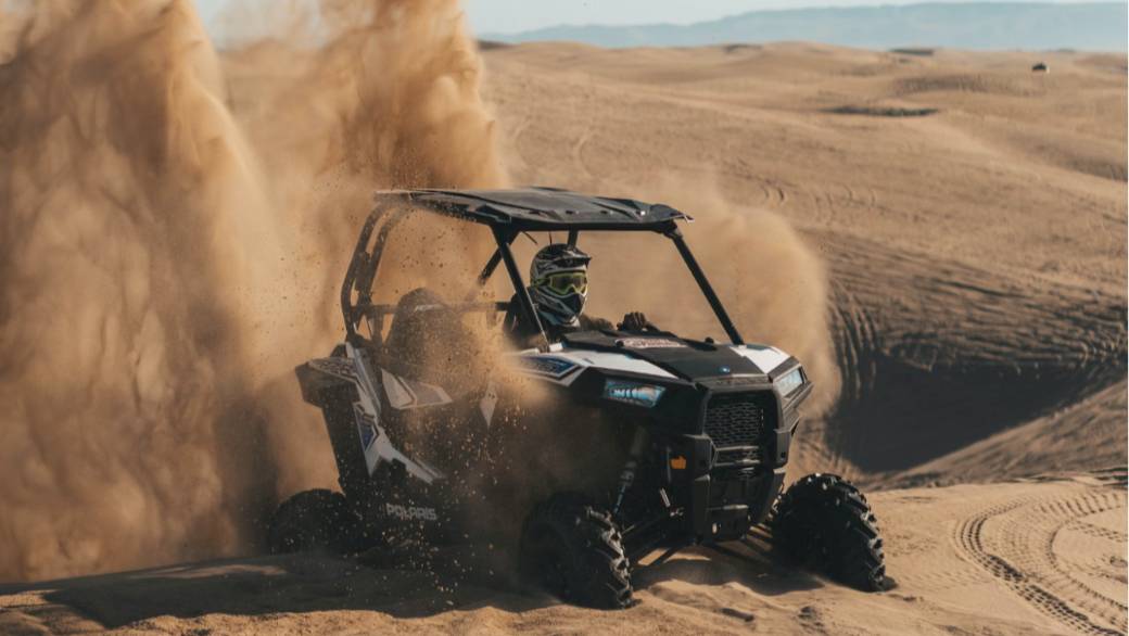 riding Polaris RZR in the desert