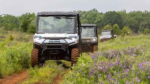 riding electric UTVs on a farm-1